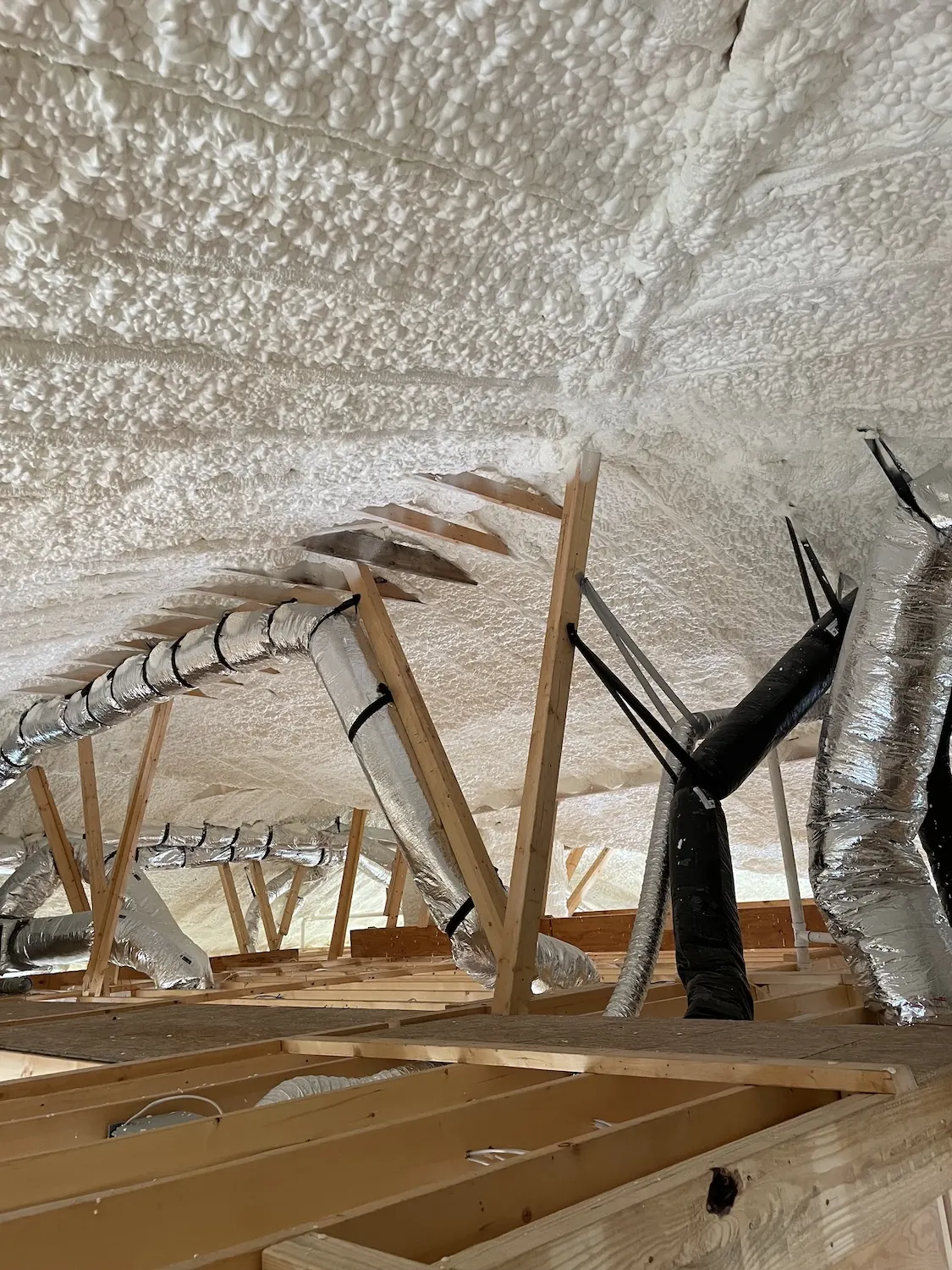 Spray foam insulation applied in attic