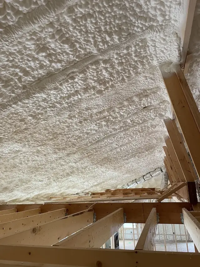 Spray foam insulation applied in attic