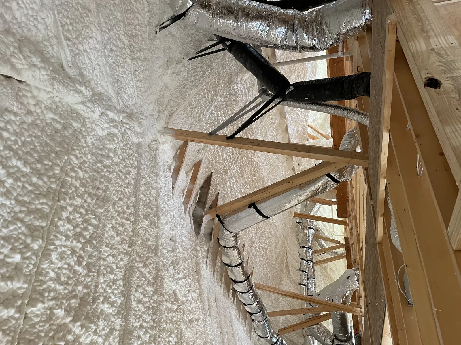 Spray foam insulation applied in an attic
