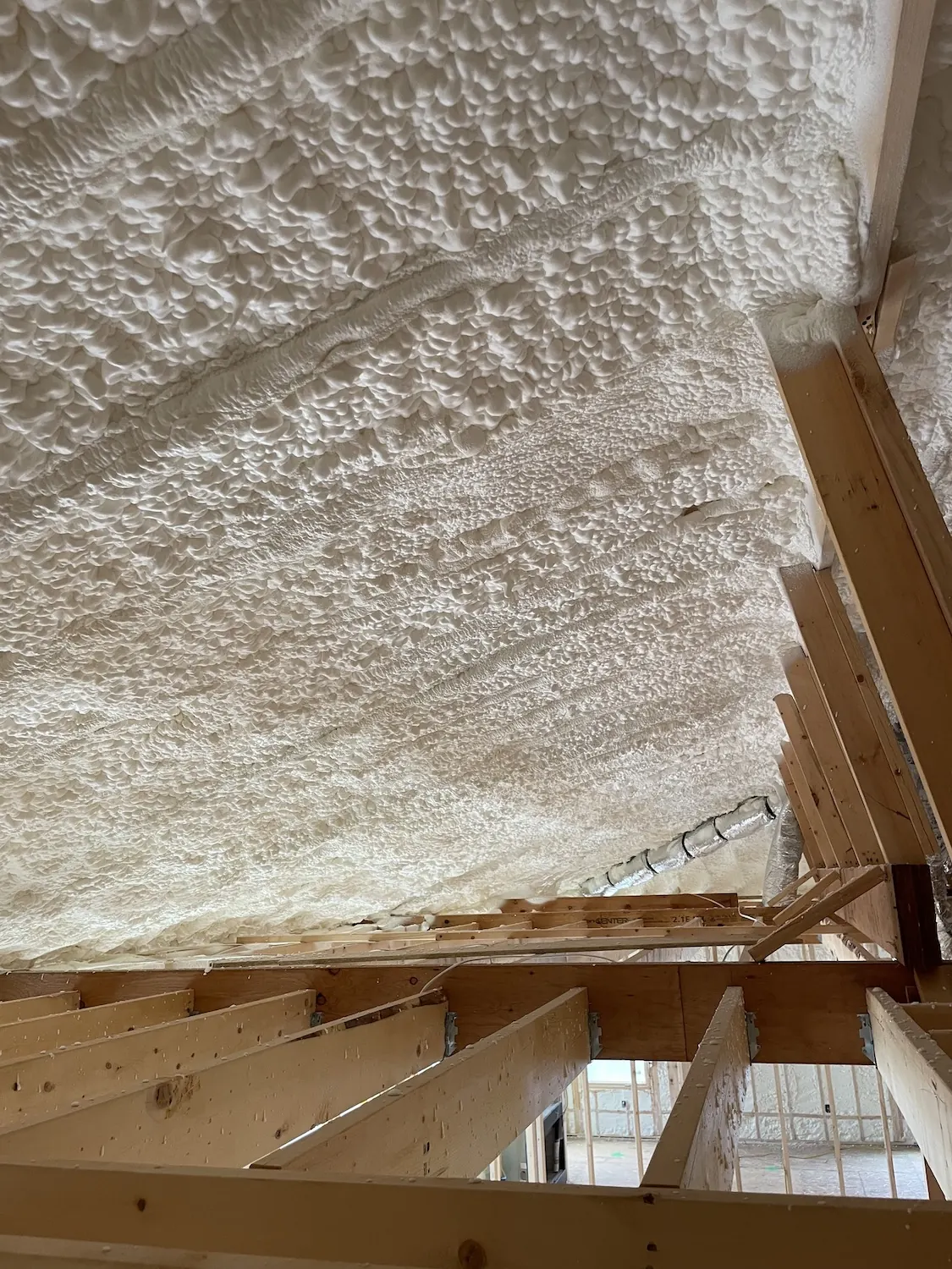 Spray foam insulation applied in attic