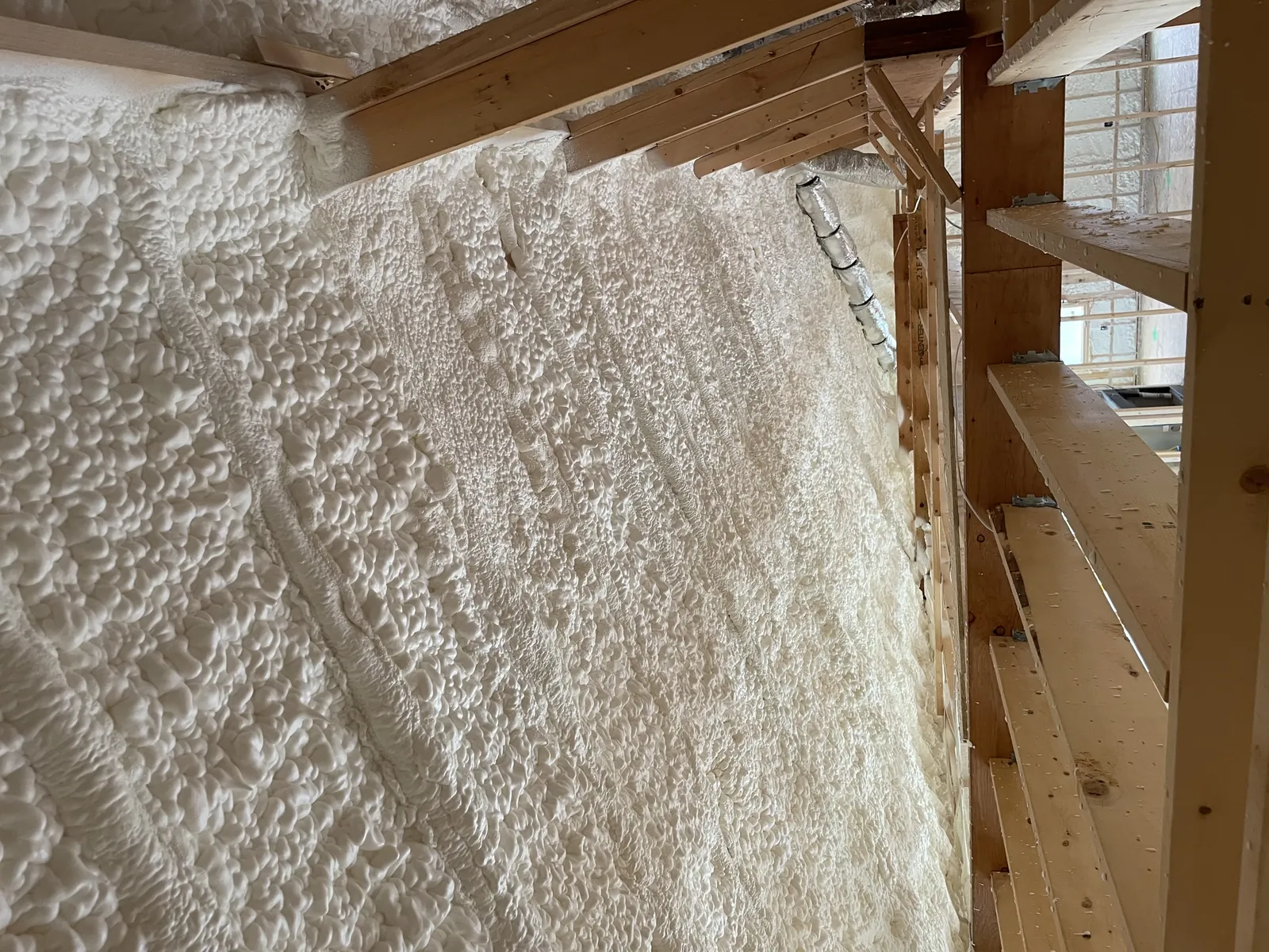 Spray foam insulation applied in an attic