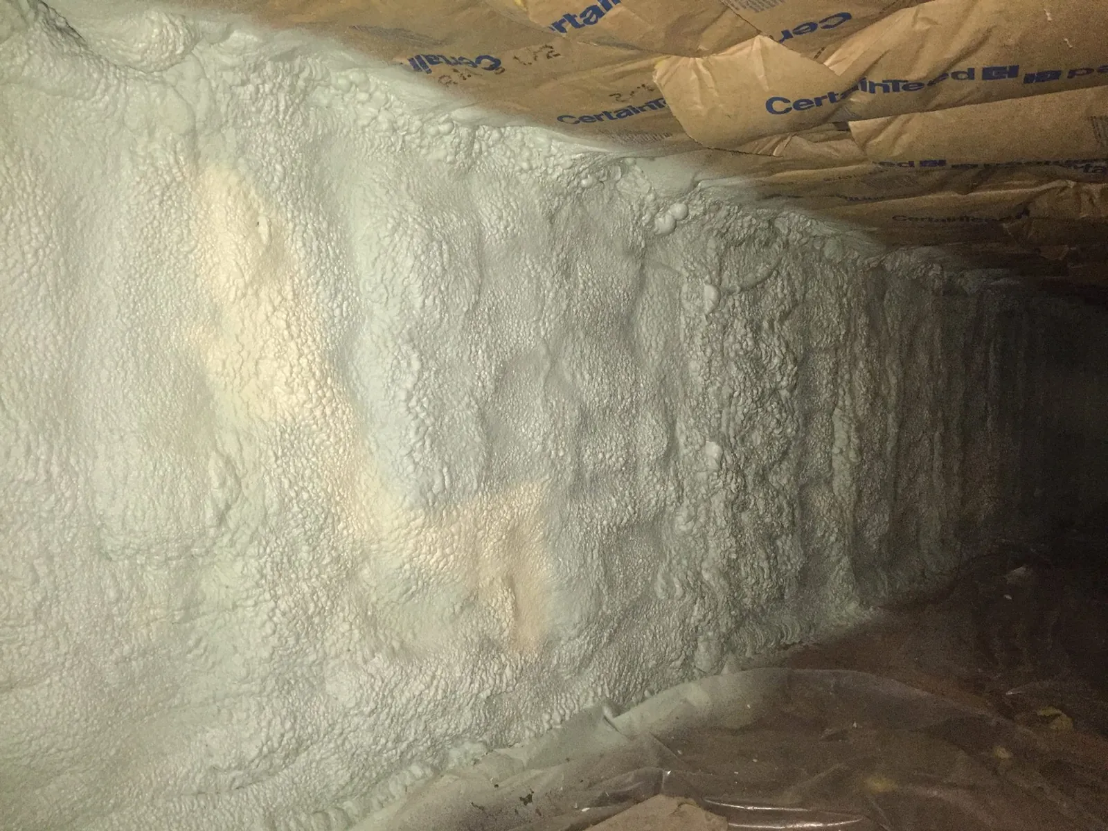 Spray foam insulation applied in crawl space